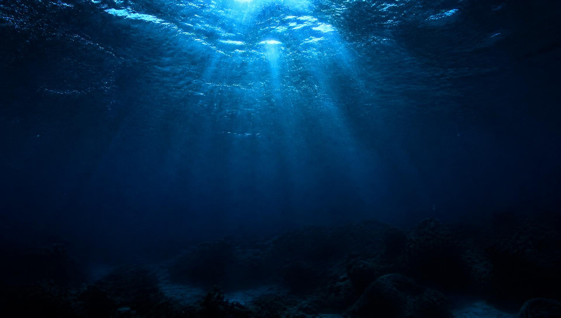 Sunlight piercing deep ocean water